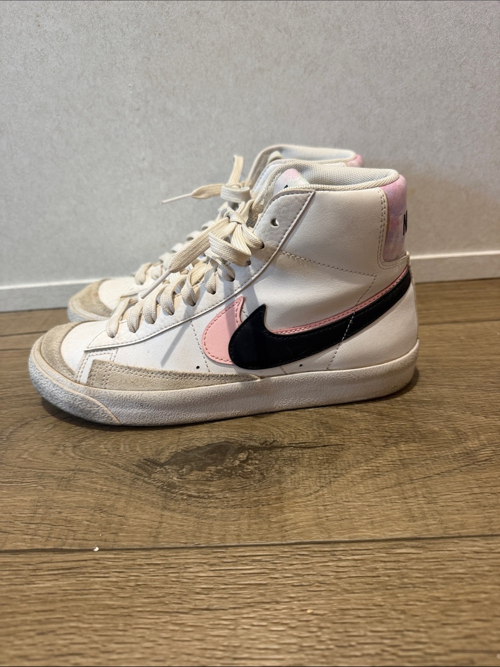 Nike Kid’s White High-Top Sneakers with Pink Accents and Black Swoosh
